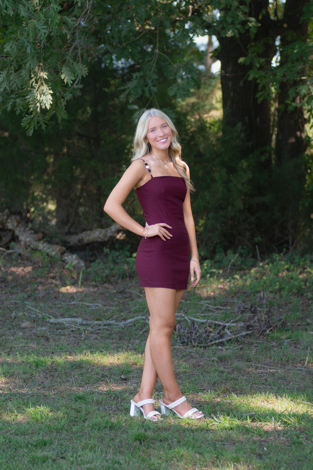 Garnet Dress with Black, White, and Gold Detailed Straps