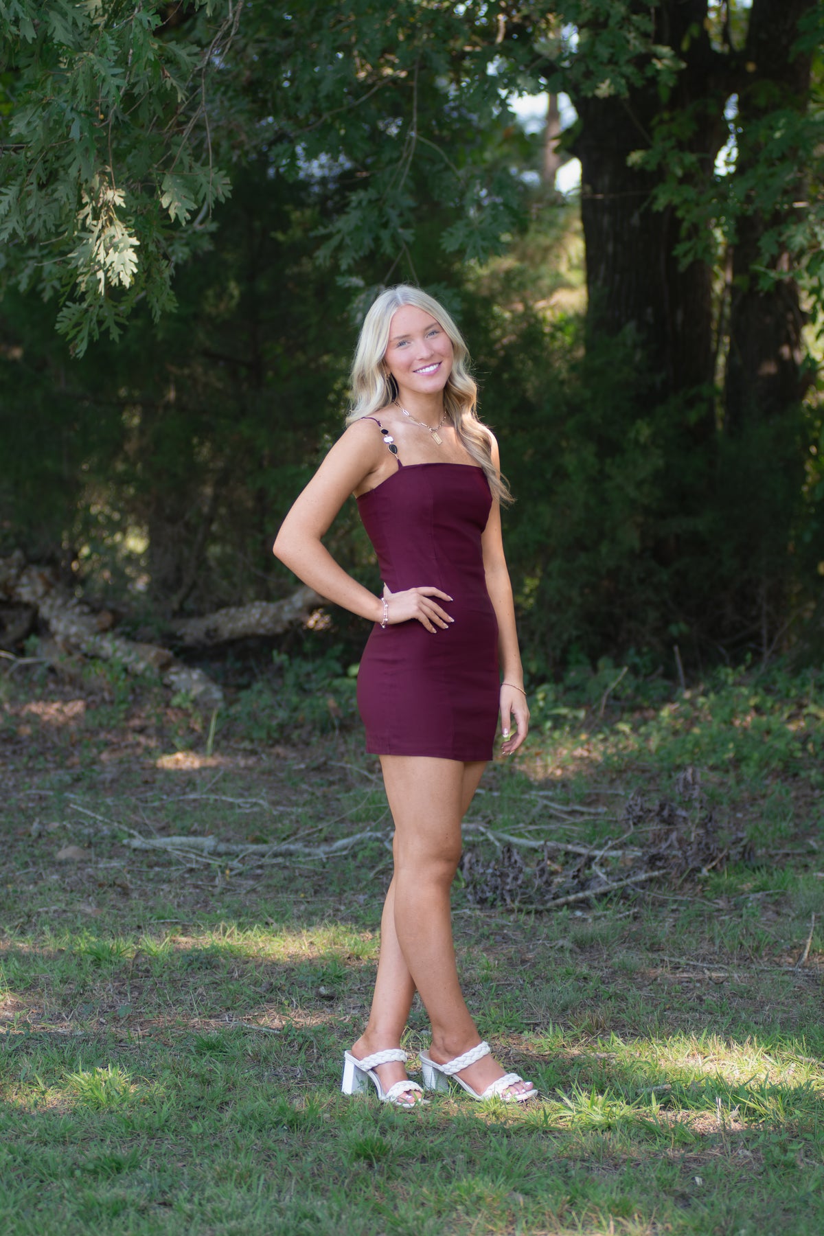 Garnet Dress with Black, White, and Gold Detailed Straps